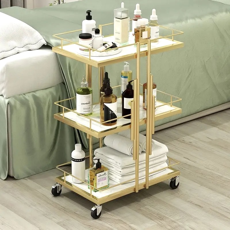 A gold marble trolley for products.